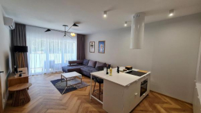 Press Apartament - salon z aneksem kuchennym, sypialnia, łazienka, taras in Pogorzelica